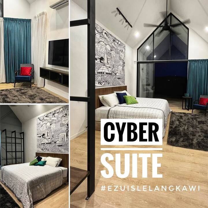 Cyber Suite: queen bed, TV lounge corner and gabled glass window